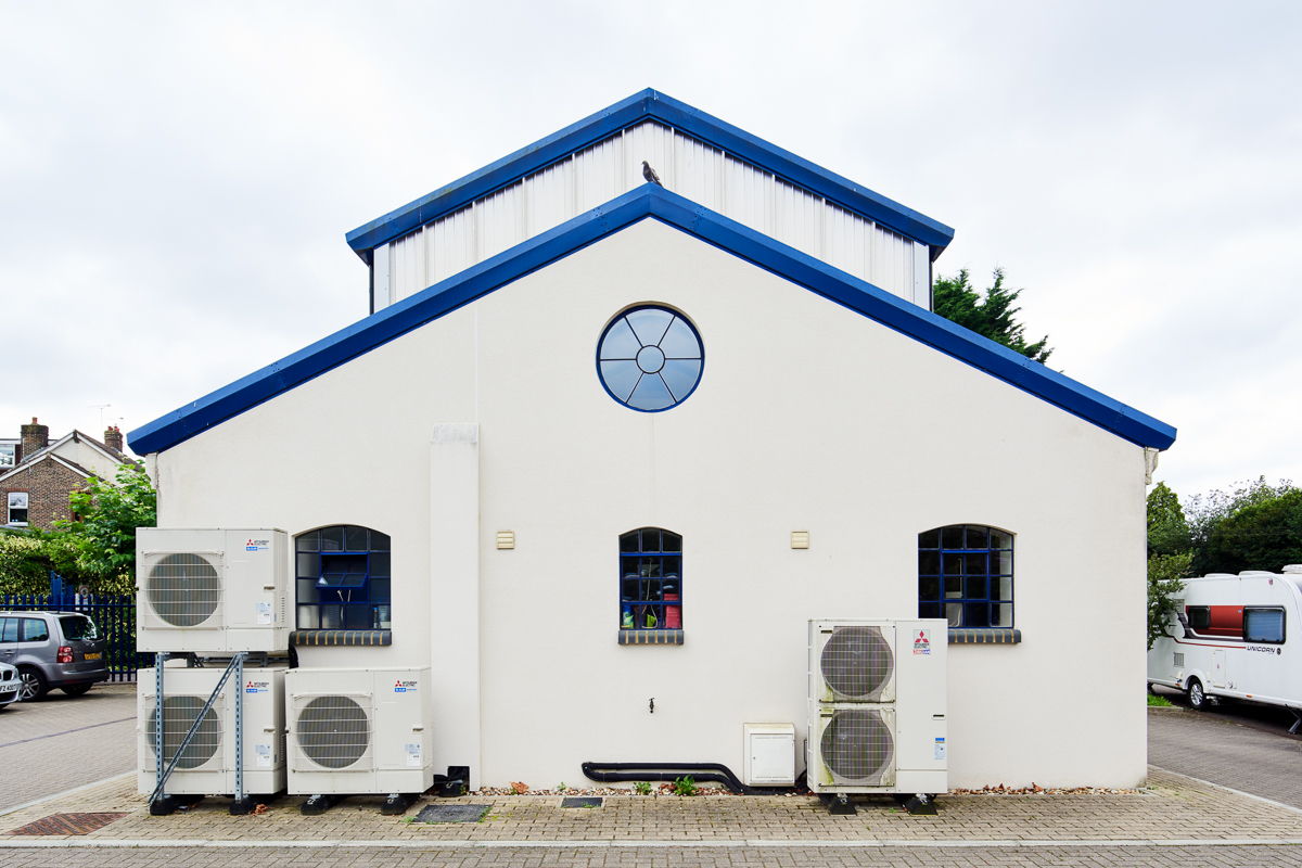 Gable elevation of the manufacturing building with visible external heat-pump equipment