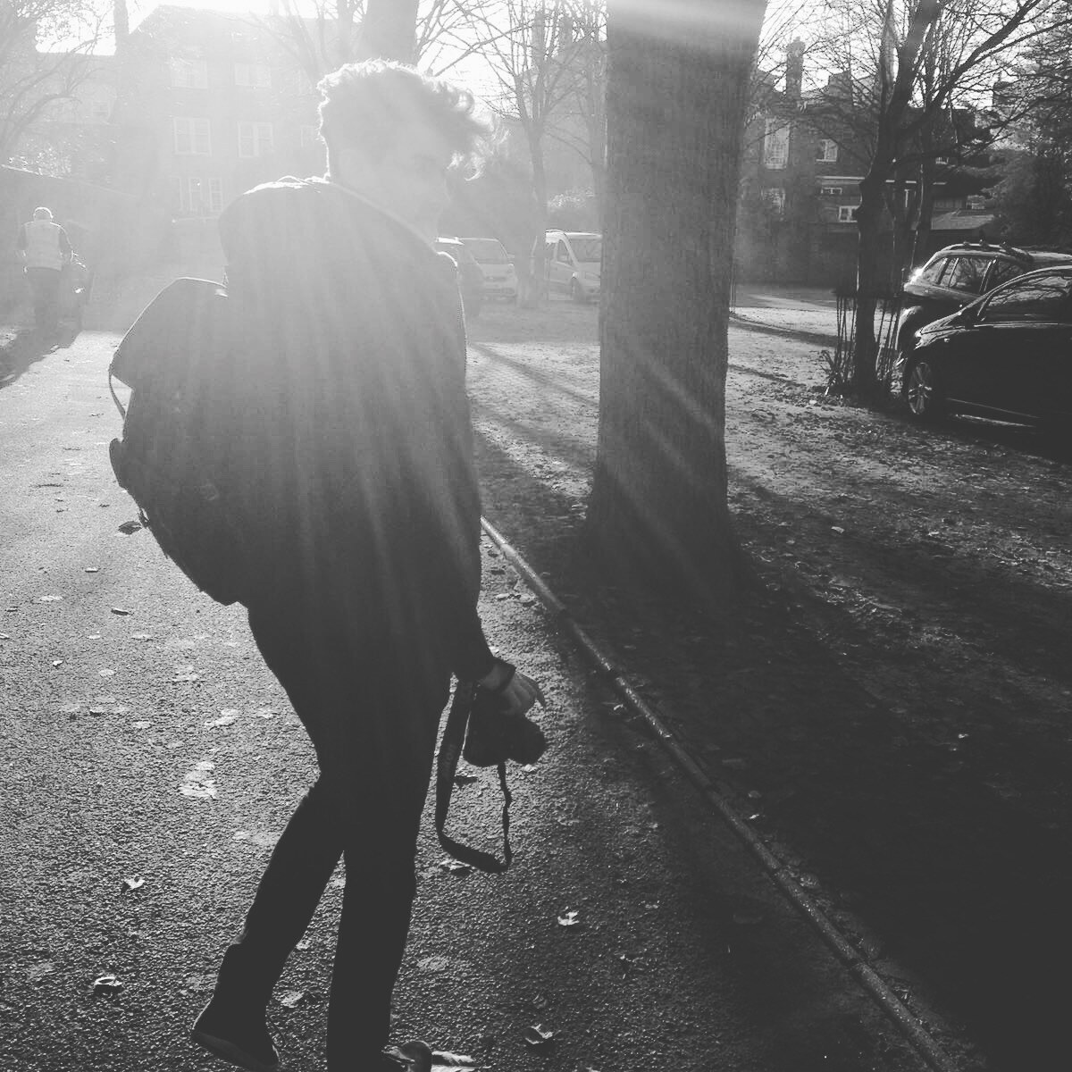 James Morris walking with camera equipment